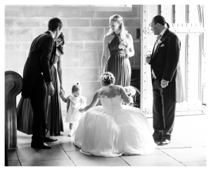 wedding photo of bride at lancing college with child