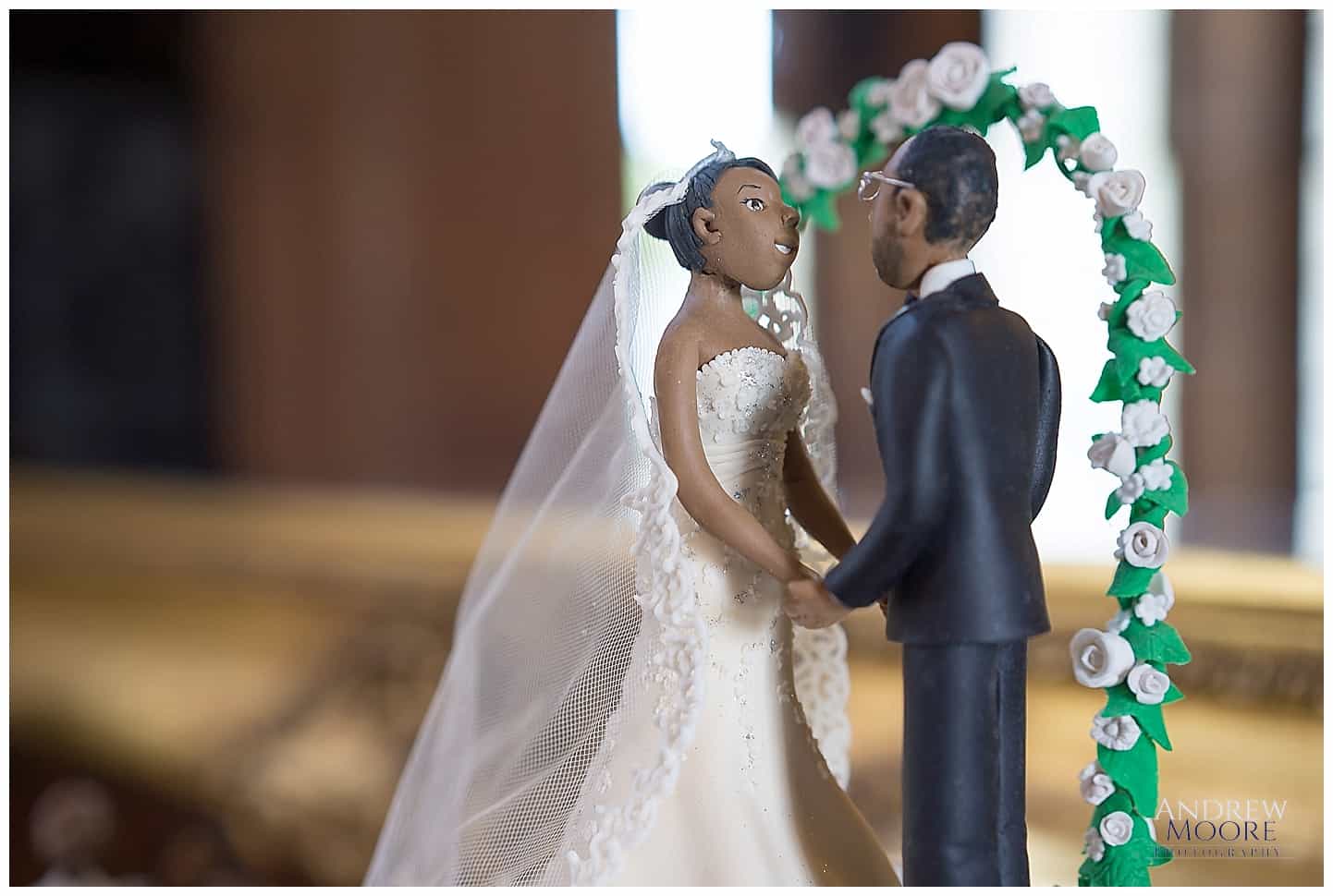amazing wedding cake with bride and groom on top.jpg