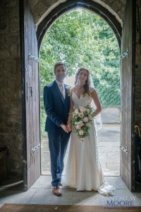 Oxon Hoath wedding couple in church doorway andrew moore photography